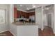 Spacious kitchen with granite countertops, stainless appliances, and wooden cabinetry at 4289 E Jasper Dr, Gilbert, AZ 85296
