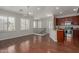 Bright open-concept living area with hardwood floors, lots of light, and a ceiling fan at 4289 E Jasper Dr, Gilbert, AZ 85296