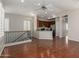 Open-concept living area with hardwood floors and an adjacent kitchen with stainless appliances at 4289 E Jasper Dr, Gilbert, AZ 85296