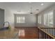 Living area with hardwood floors, bright windows, and a breakfast bar with a sink at 4289 E Jasper Dr, Gilbert, AZ 85296
