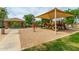 Community playground with shaded play structures and a covered picnic area, perfect for families at 4289 E Jasper Dr, Gilbert, AZ 85296