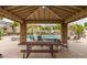 Relax at the community pool pavilion with picnic tables and seating, ideal for gatherings and enjoying the poolside view at 4289 E Jasper Dr, Gilbert, AZ 85296
