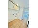 Functional laundry room with overhead cabinets, tile floor, and doorway leading to another room at 4349 E Encinas Ave, Gilbert, AZ 85234