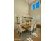 Bright dining room features a modern chandelier, high ceilings, shuttered windows and a large mirror at 4611 E Casitas Del Rio Dr, Phoenix, AZ 85050