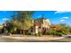 Attractive two-story home with a well-manicured front yard on a corner lot at 4611 E Casitas Del Rio Dr, Phoenix, AZ 85050