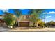 Charming two-story home featuring a brick driveway, desert landscaping, and a two-car garage at 4611 E Casitas Del Rio Dr, Phoenix, AZ 85050