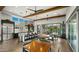 Spacious common kitchen with stainless steel appliances, bar seating and patio access at 4611 E Casitas Del Rio Dr, Phoenix, AZ 85050