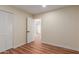 Spacious bedroom featuring laminate flooring, neutral paint, and closet with sliding doors at 4739 W Paradise Ln, Glendale, AZ 85306