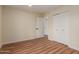 Bedroom features wood-look flooring, a large closet, and neutral walls, providing a versatile space at 4739 W Paradise Ln, Glendale, AZ 85306