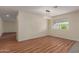 Bright dining room features wood-look flooring, modern light fixture, and large window views of the backyard at 4739 W Paradise Ln, Glendale, AZ 85306