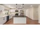 Updated kitchen features white cabinets, stainless appliances, dark countertops, and a view of the backyard at 4739 W Paradise Ln, Glendale, AZ 85306