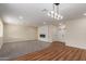Bright living room featuring stylish lighting, carpet and hardwood flooring at 4739 W Paradise Ln, Glendale, AZ 85306