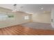 Bright living room featuring stylish lighting, carpet and hardwood flooring at 4739 W Paradise Ln, Glendale, AZ 85306