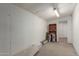 Spacious storage room features a door and paint cans ready for your project at 4739 W Paradise Ln, Glendale, AZ 85306