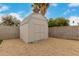 A matching exterior storage shed on a gravel bed at 4739 W Paradise Ln, Glendale, AZ 85306