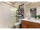 Bathroom featuring a shower with sliding glass door, vanity, and shelving at 535 E Yellow Wood Ave, San Tan Valley, AZ 85140