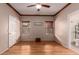 Spacious bedroom with ceiling fan, two windows, and wood-look flooring at 535 E Yellow Wood Ave, San Tan Valley, AZ 85140