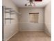 Bedroom showcases window and tile flooring, plus a custom adjustable wall organizer at 535 E Yellow Wood Ave, San Tan Valley, AZ 85140