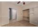 Bedroom with tile flooring, neutral paint, closet with adjustable shelving, and attached office space at 535 E Yellow Wood Ave, San Tan Valley, AZ 85140