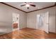 Bedroom featuring wood-look flooring and access to a private bathroom at 535 E Yellow Wood Ave, San Tan Valley, AZ 85140