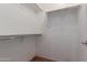 Walk-in closet with built-in shelving and carpeted floor at 535 E Yellow Wood Ave, San Tan Valley, AZ 85140