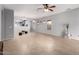 A spacious living room with tile flooring, neutral walls, and ceiling fan at 535 E Yellow Wood Ave, San Tan Valley, AZ 85140