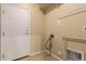 The utility room features a back door, tile floors, and utility hookups at 535 E Yellow Wood Ave, San Tan Valley, AZ 85140