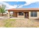 View of the covered patio with a lawn area and fenced yard at 6436 W Wahalla Ln, Glendale, AZ 85308