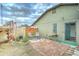 Charming backyard patio with a brick surface, seating, a garden, and mature landscaping at 6461 E Jensen St, Mesa, AZ 85205