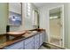 Stylish bathroom with dual copper vessel sinks, wood countertops, and modern fixtures at 6461 E Jensen St, Mesa, AZ 85205