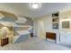 Unique bedroom with modern colors, light grey flooring and built-in features for space saving solutions at 6461 E Jensen St, Mesa, AZ 85205