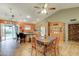 Bright, open kitchen featuring a breakfast bar, stainless steel appliances, and a dining area with backyard access at 6461 E Jensen St, Mesa, AZ 85205