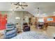 Inviting living room with hardwood floors, a cozy seating area, and views of the open-concept dining and kitchen at 6461 E Jensen St, Mesa, AZ 85205