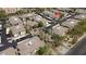 An aerial view showcasing a well-maintained community with lush landscaping, covered parking, and a sparkling pool at 6900 E Princess Dr # 2124, Phoenix, AZ 85054