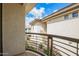 Balcony view showcasing the exterior of the building, landscaping, and clear blue skies at 6900 E Princess Dr # 2124, Phoenix, AZ 85054