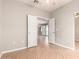 Bedroom featuring double doors, a ceiling fan, mirrored closet doors, and wood floors at 6900 E Princess Dr # 2124, Phoenix, AZ 85054