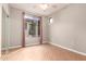 Bedroom featuring wood floors, a large window, and natural light at 6900 E Princess Dr # 2124, Phoenix, AZ 85054