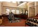 Community gym featuring weight lifting machines and free weights at 6900 E Princess Dr # 2124, Phoenix, AZ 85054