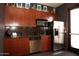 Kitchenette includes stainless steel appliances, backsplash, ample countertop space at 6900 E Princess Dr # 2124, Phoenix, AZ 85054