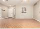 Open living room with laminate flooring, ceiling fan, and pass-through to the kitchen at 6900 E Princess Dr # 2124, Phoenix, AZ 85054