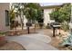 Community offers outdoor grills in courtyard with walkways, gravel, seating, and desert landscaping at 6900 E Princess Dr # 2124, Phoenix, AZ 85054
