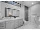 Bright bathroom featuring double vanity with marble counters and glass enclosed shower at 7009 E Pasadena Ave, Paradise Valley, AZ 85253