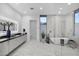 This spacious primary bath offers double vanity, soaking tub, and large glass shower at 7009 E Pasadena Ave, Paradise Valley, AZ 85253