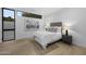 Bedroom with light hardwood floors, picture window, and custom night stands at 7009 E Pasadena Ave, Paradise Valley, AZ 85253