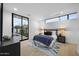Light and airy bedroom offers access to backyard via sliding glass door and backyard views at 7009 E Pasadena Ave, Paradise Valley, AZ 85253