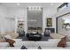 Inviting living room featuring a modern fireplace, stylish furniture, and abundant natural light at 7009 E Pasadena Ave, Paradise Valley, AZ 85253