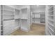 Walk in closet offering custom storage, shelving, and drawers for optimal organization at 7009 E Pasadena Ave, Paradise Valley, AZ 85253