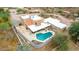 Aerial view of private home with pool, patios, and desert landscaping at 706 N Signal Butte Rd, Mesa, AZ 85207