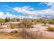 Aerial view of a beautiful desert home in a vibrant community, showcasing its unique architecture and landscaping at 706 N Signal Butte Rd, Mesa, AZ 85207