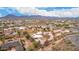 Mountains in the background of this aerial view of a desert community with custom homes at 706 N Signal Butte Rd, Mesa, AZ 85207